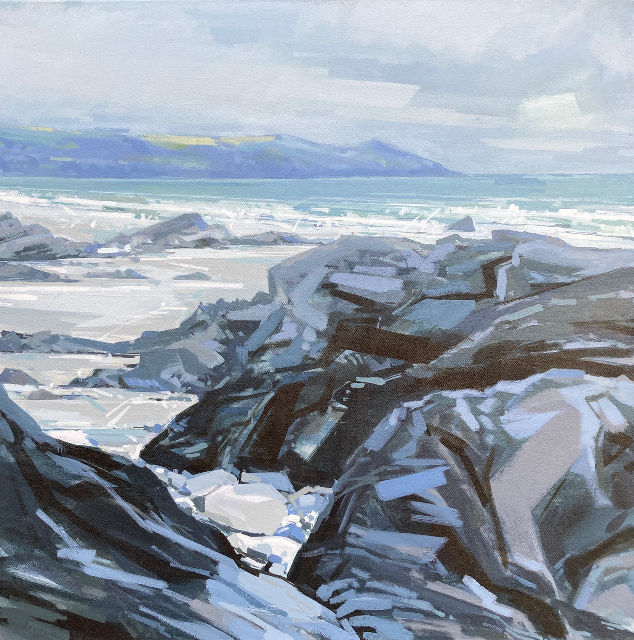 Rocks surrounded by sea with peninsula in the background, blue sky and white clouds by Cornish artist Imogen Bone