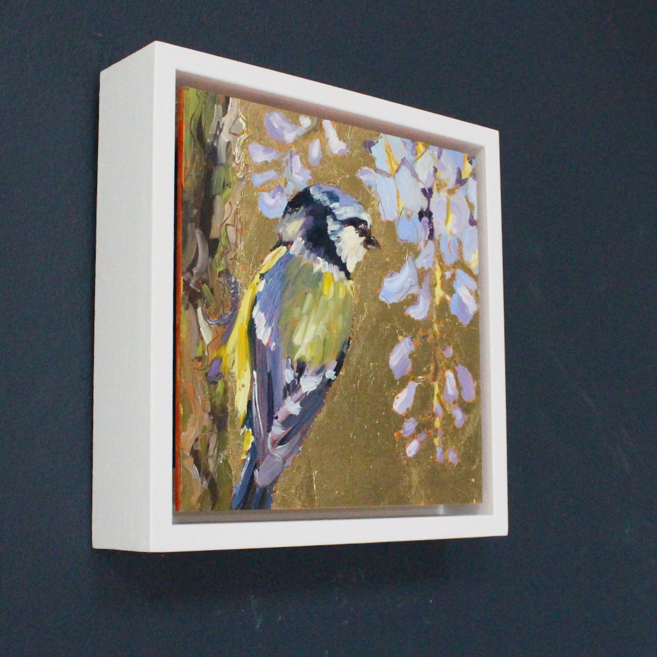 Artist Jill Hudson framed square gold lustre background with blue tit and blue flowers.