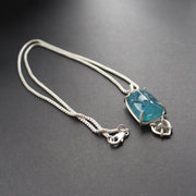 a pendant with large blue aquamarine and small diamond in a silver setting  by Cornwall jeweller Carin Lindberg