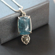 a pendant with large blue aquamarine and small diamond in a silver setting  by jeweller Carin Lindberg
