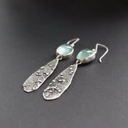 long lozenge shaped textured silver earrings with pale blue aquamarine stone setting by Carin Lindberg