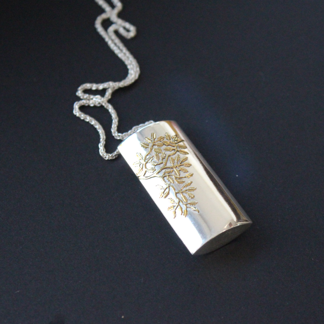 Silver box pendant with flower design by UK artist Beverly Bartlett.
