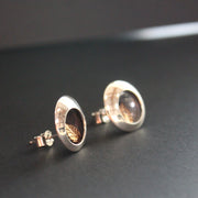 Round silver stud earrings with leaf inlay by UK artist Beverly Bartlett.