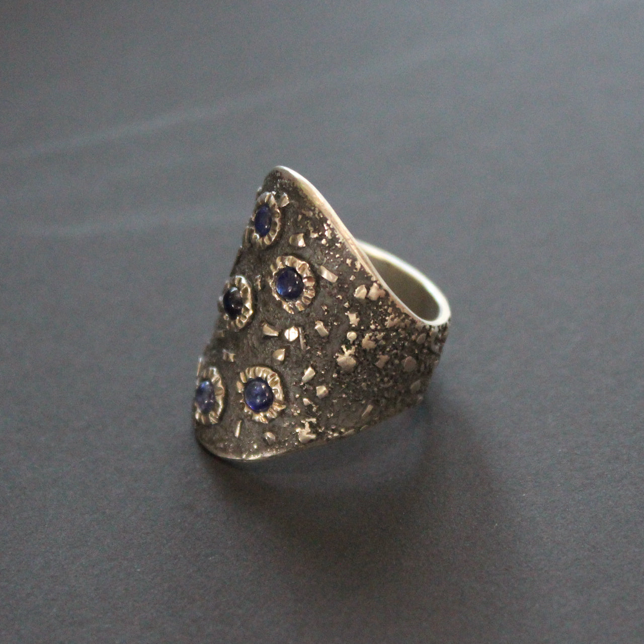 a Carin Lindberg large textured silver ring set with blue sapphires