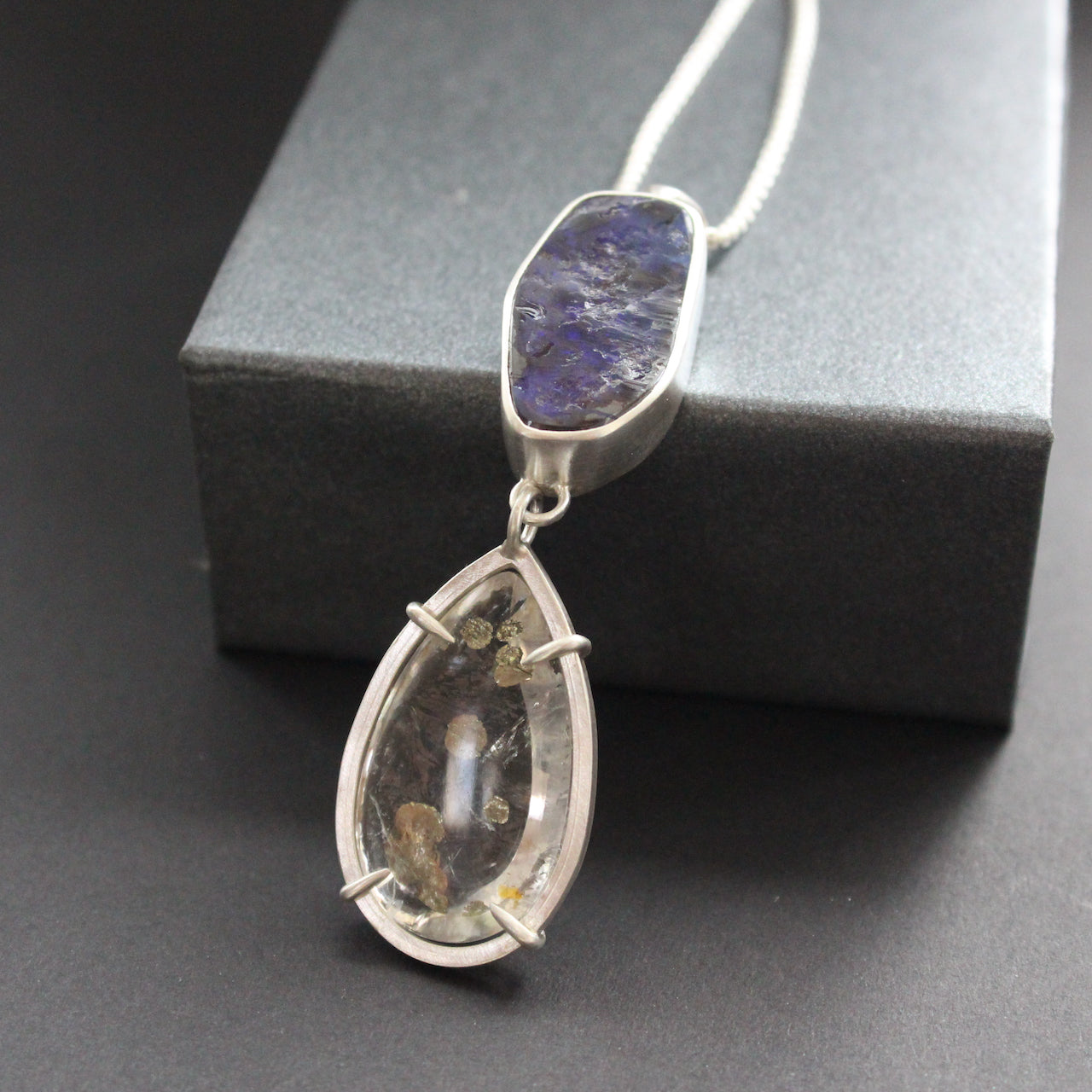 a pendant with large purple opal in a silver setting by jeweller Carin Lindberg
