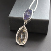 a pendant with large purple opal in a silver setting by jeweller Carin Lindberg