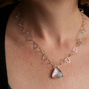 Silver triangle link necklace with triangle Fire Quartz stone pendant by artist Lucy Spink