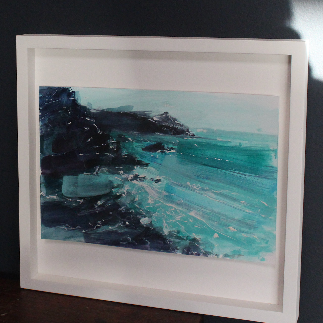 Jill Hudson watercolour painting on Rame Head in Cornwall with dark rocks and a turquoise sea