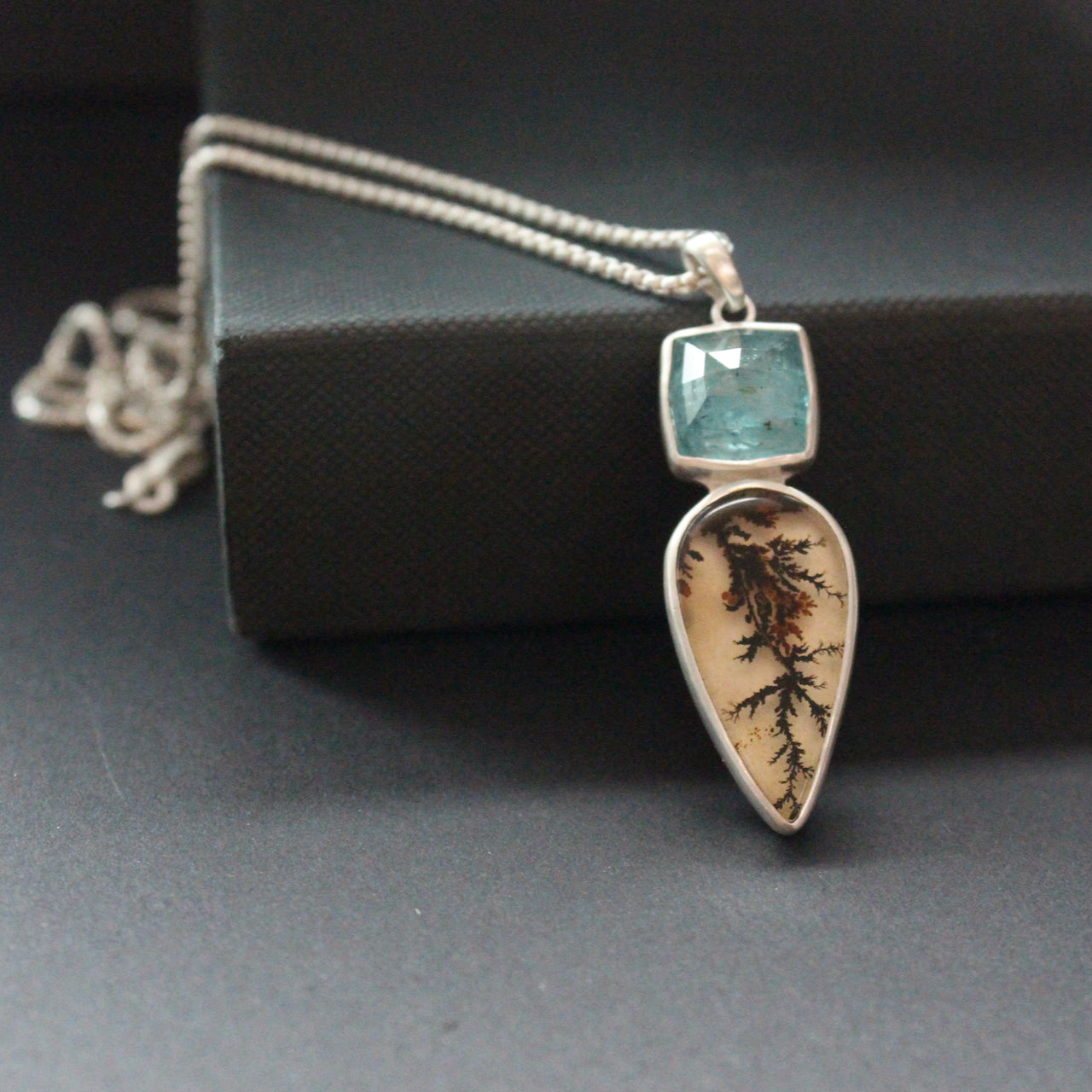 Carin Lindberg -  Dendritic Agate drop shaped pendant with turquoise blue tourmaline in silver setting