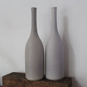 a pair of grey ceramic bottles by UK ceramicist Lucy Burley.