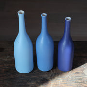 a trio of ceramic bottles in shades of blue by UK ceramic artist Lucy Burley.