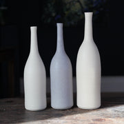 trio of ceramic bottles in pale, neutral shades by UK ceramic artist Lucy Burley