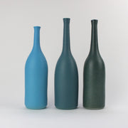 a trio of  ceramic bottles in shades of teal and blue by UK ceramicist Lucy Burley.