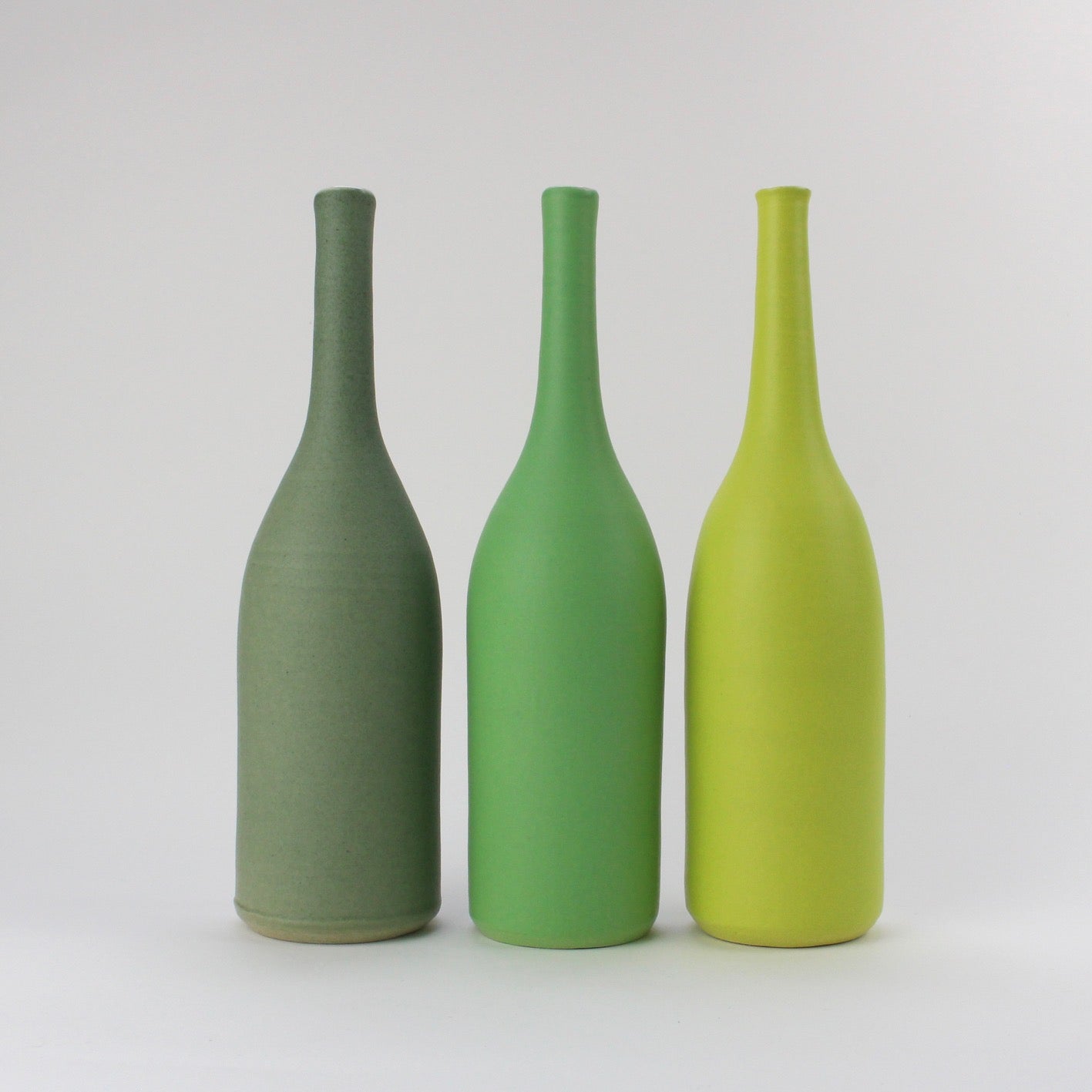 trio of green ceramic bottles by UK potter Lucy Burley.