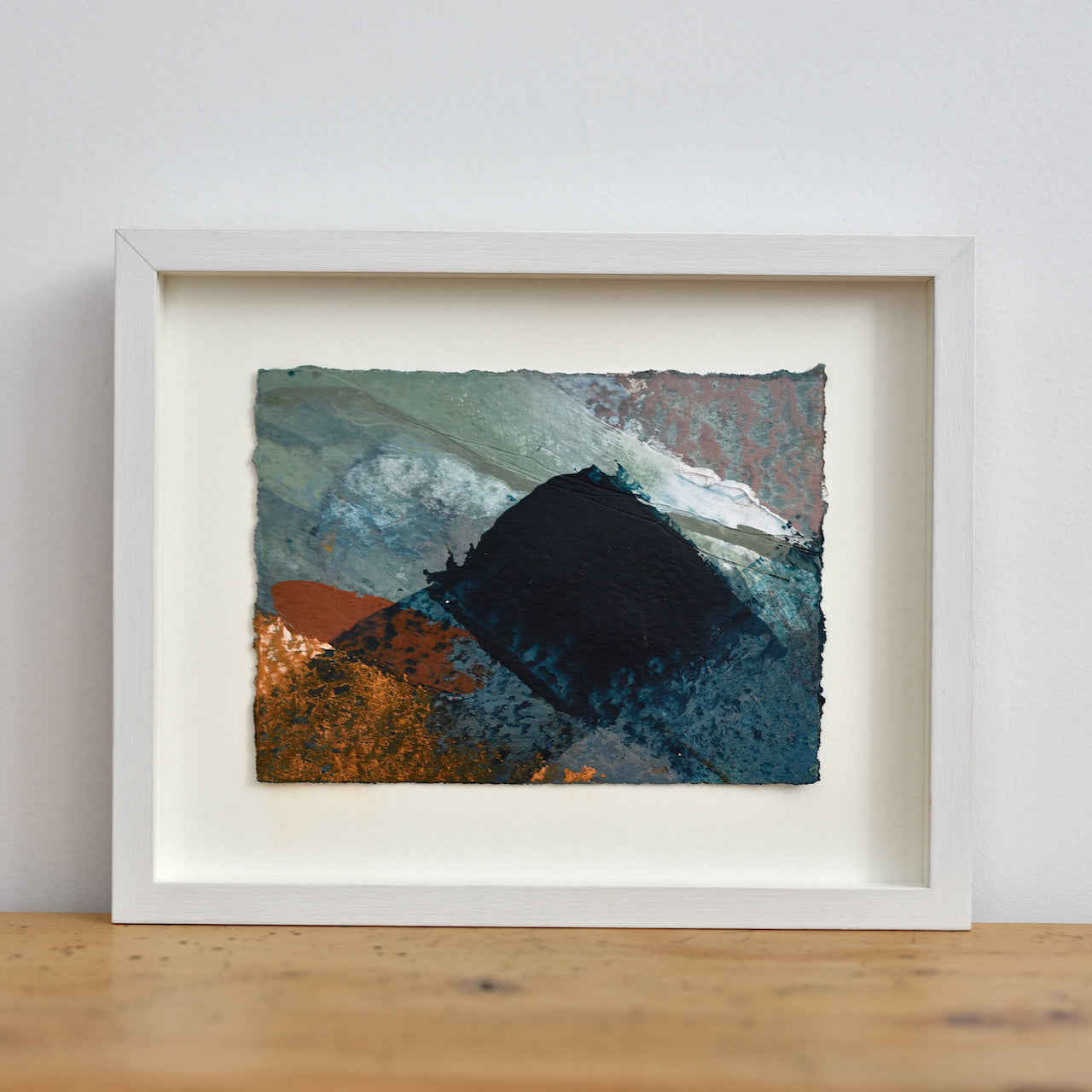 Abstract mixed media painting of blue and orange tones by Alice Robinson-Carter.