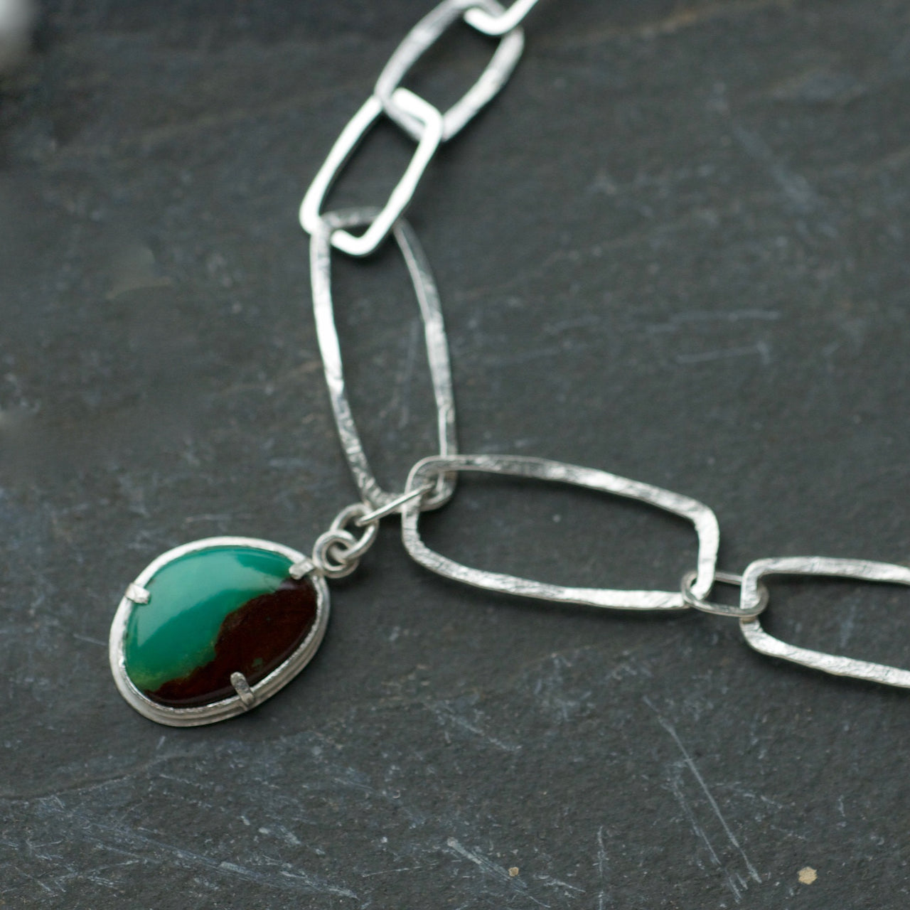 Monolith shaped silver chain link necklace with Chrysoprase Pendant by artist Lucy Spink.