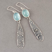 long lozenge shaped textured silver earrings with pale blue aquamarine stone setting by Uk jeweller Carin Lindberg