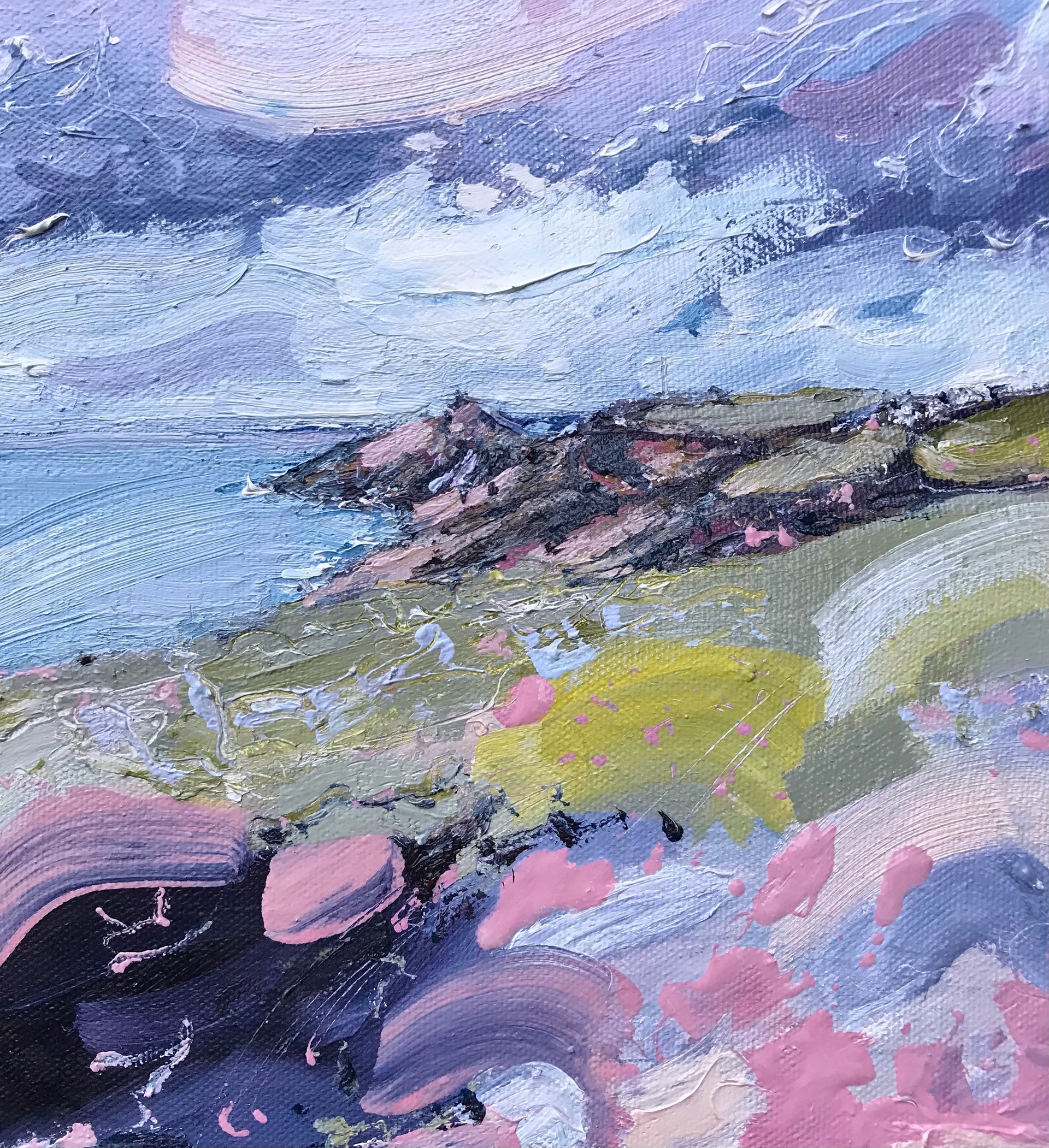 colourful Jill Hudson oil painting of Rame Head in south east Cornwall: the headland is green and pink under a blue and white sky and the foreground shows yellow and pink wildflowers