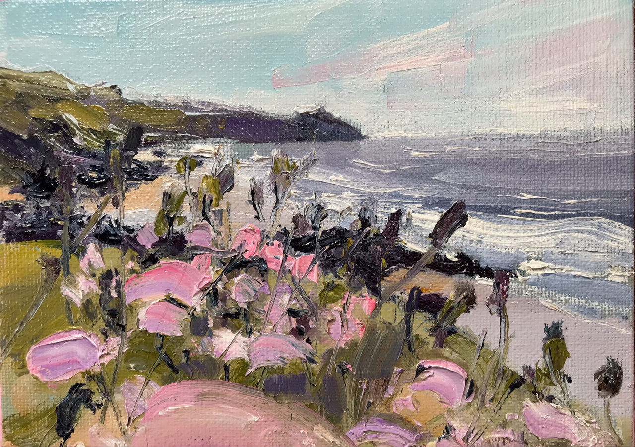 Pink and ochre flowers in foreground with ocean and headland behind by artist Jill Hudson