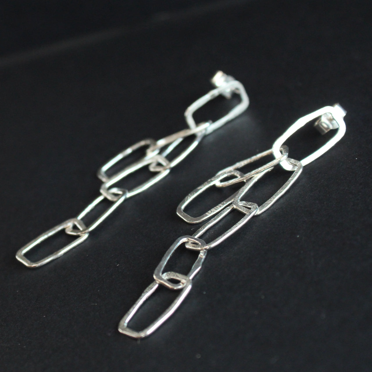 Silver mini monolith shape chain earrings by Cornish artist Lucy Spink