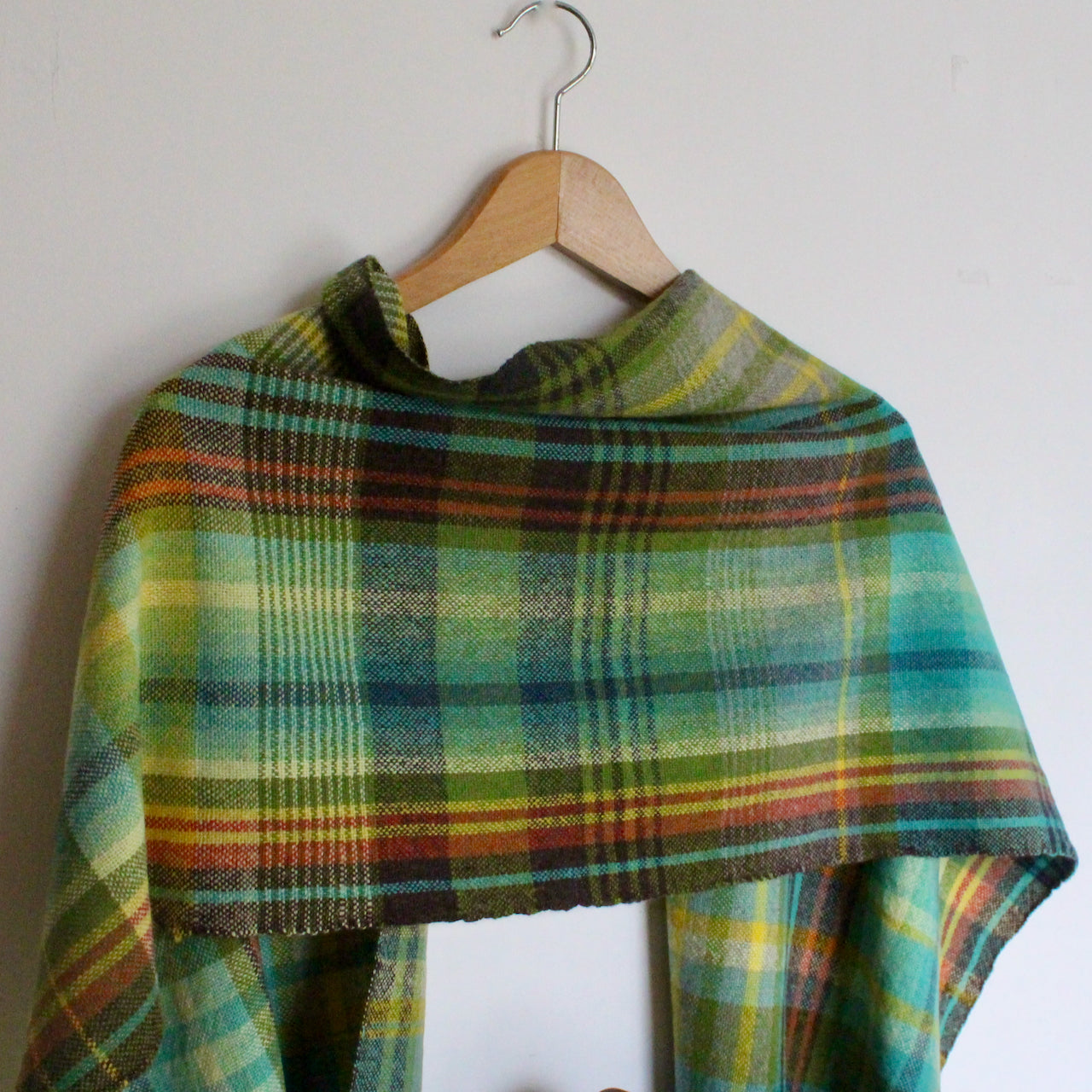 handwoven woollen scarf by Teresa Dunne Cornish weaver in turquoise, green and yellow.