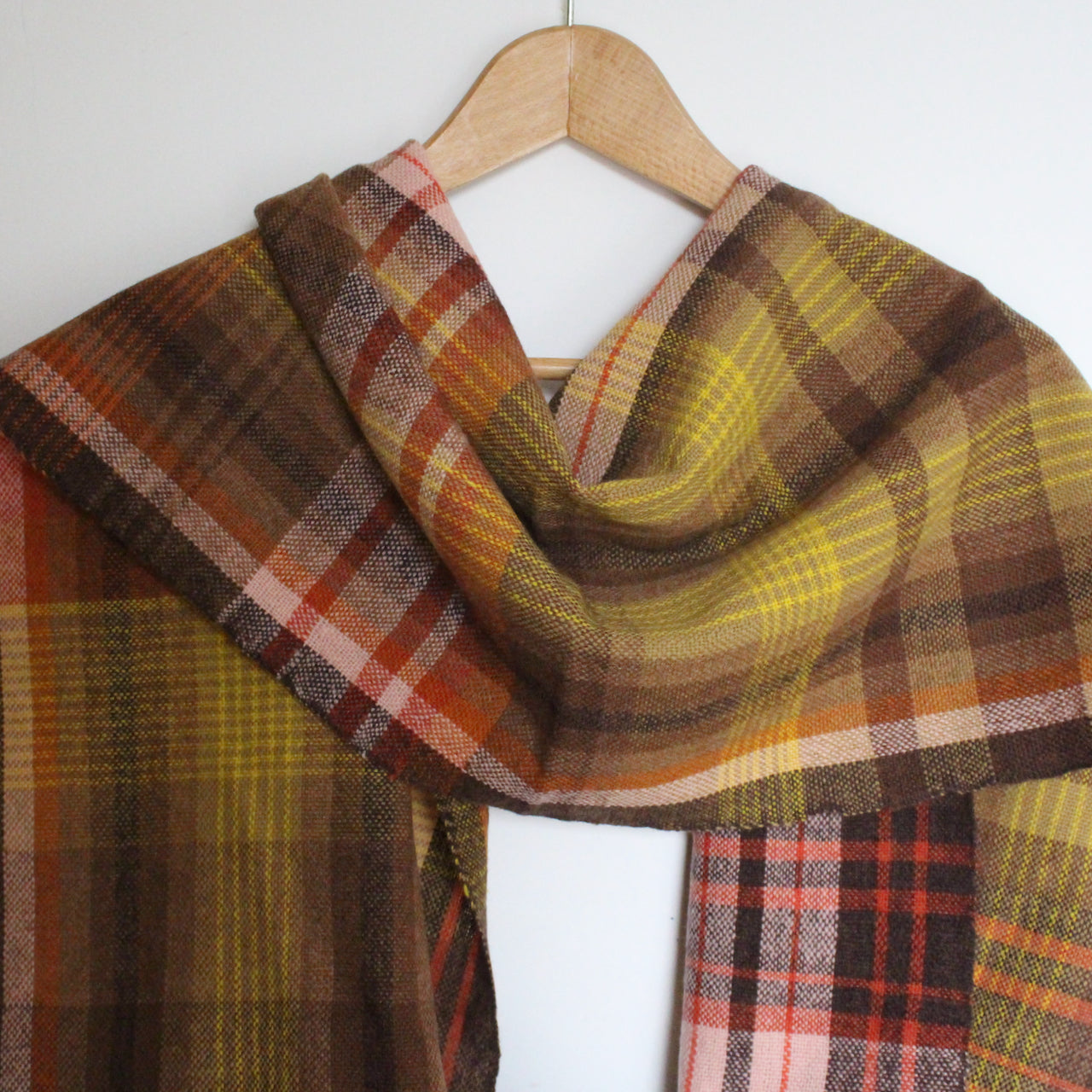 handwoven woollen scarf by Teresa Dunne Cornish weaver in brown, orange and yellow.