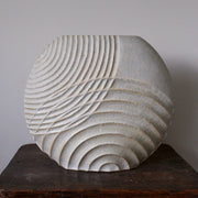 Michele Bianco pale white stoneware ceramic disc shaped vessel with carved overlapping lines.
