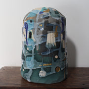textured green and blue ceramic bottle by Dawn Hajittofi, ceramic artist.