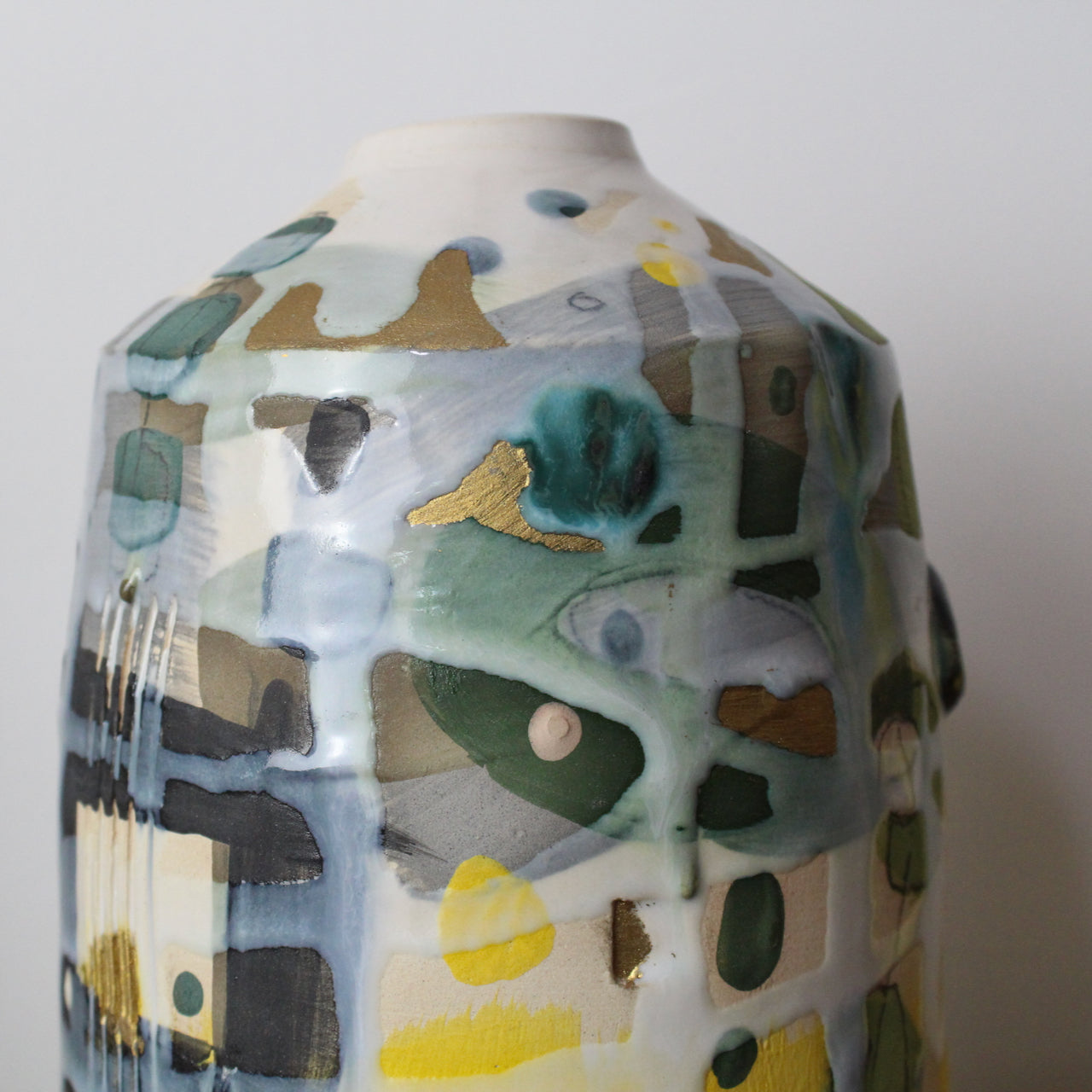 ceramic bottle in yellow, grey and green by UK ceramicist Dawn Hajittofi