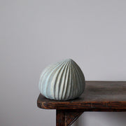 pale green carved stoneware ceramic pod shaped sculpture by Michele Bianco