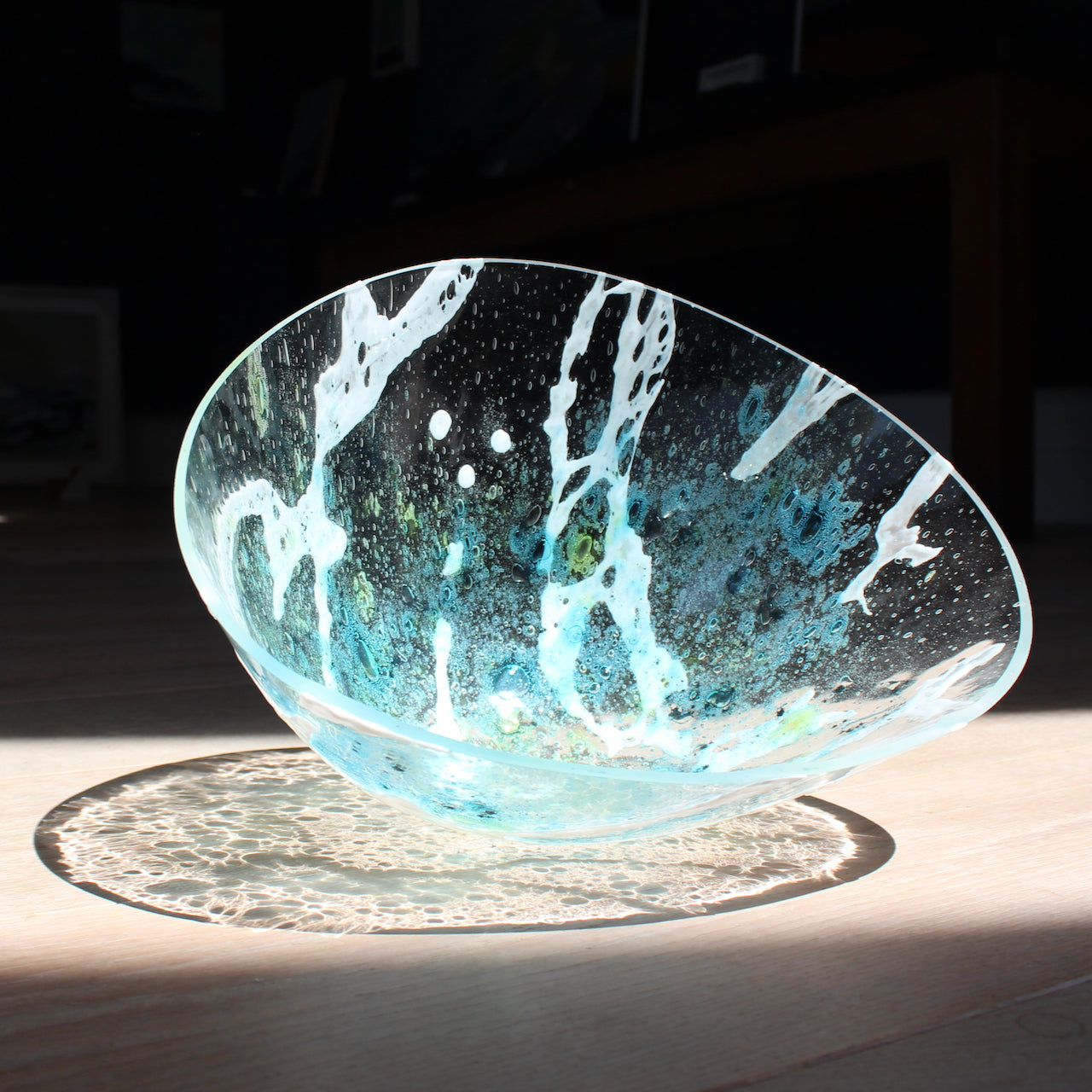 irregular shaped glass vessel in clear, blue and white glass by Cornish glass artist Helen Eastham