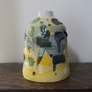 ceramic bottle in yellow, green and blue by Uk ceramicist Dawn Hajittofi