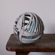 A Michele Bianco carved and open round ceramic sculpture.
