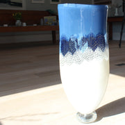 Tall blue and white glass vessel by glass artist Benjamin Lintell at the Byre Gallery