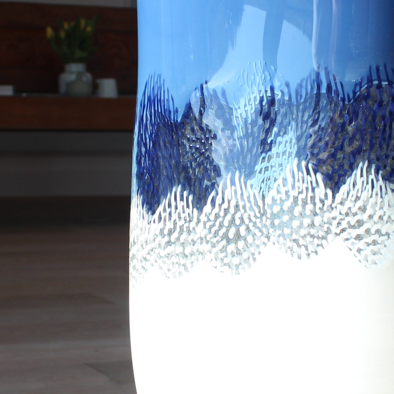close up of a detail in a blue and white glass vessel by glass artist Benjamin Lintell