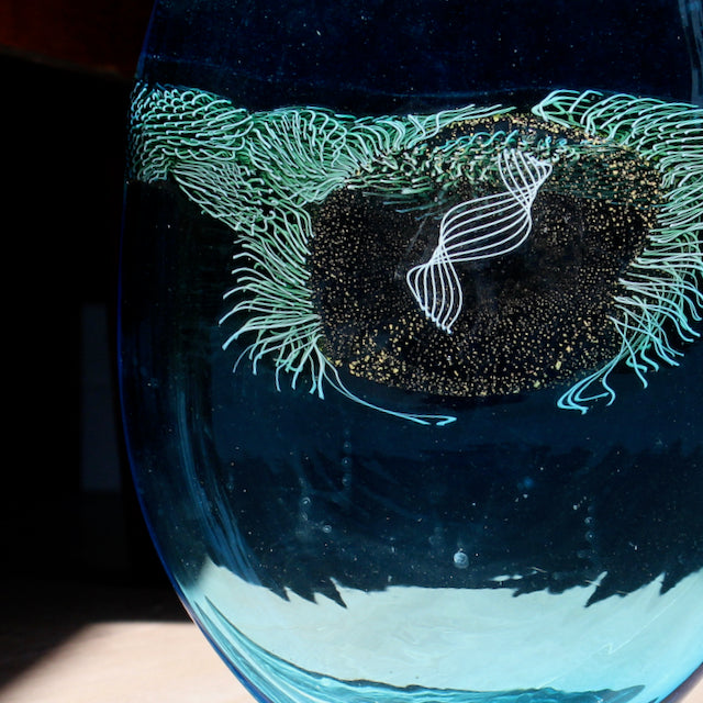 blue glass vessel with centre detail by Benjamin Lintell