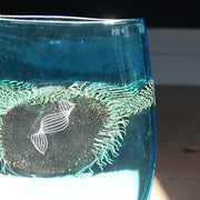 close up of blue glass vessel with centre detail by Benjamin Lintell.