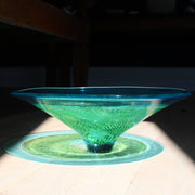 reflection of blue and green glass bowl by Benjamin Lintell  photographed in sunlight