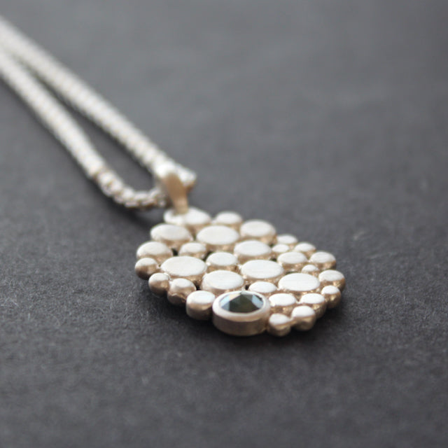 Multi pebble pendant with blue diamond by Carin Lindberg
