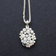 Multi pebble pendant with blue diamond by Carin Lindberg