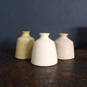 white, yellow and pale pink bud vases by EOT ceramics
