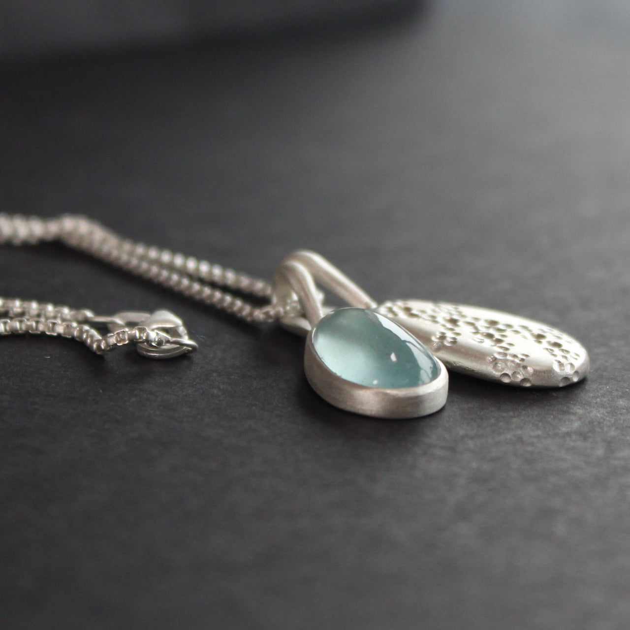 Carin Lindberg - Moss aquamarine and textured silver pebble pendants