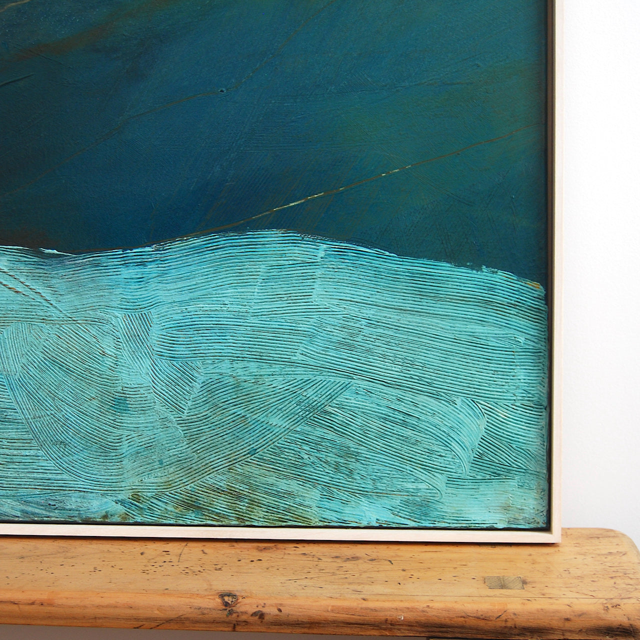 close up detail of texture in a Alice Robinson-Carter abstract painting called Freathy which depicts a dark blue sky with a paler sea.