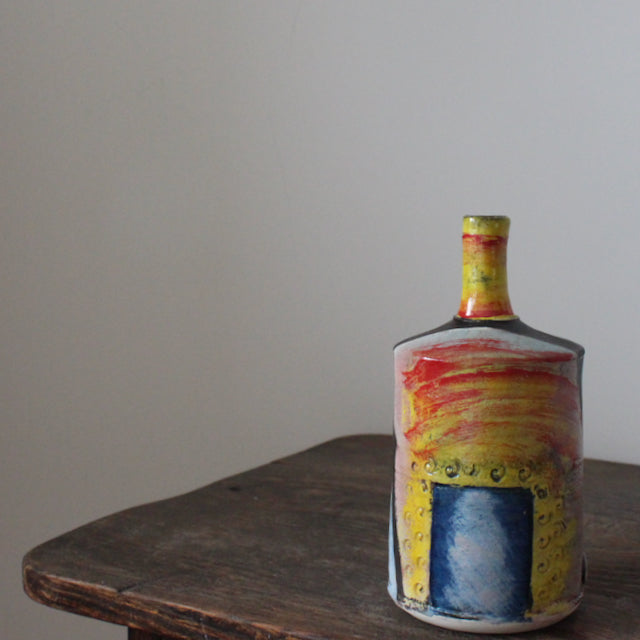 red, yellow and blue ceramic bottle by UK ceramicist John Pollex