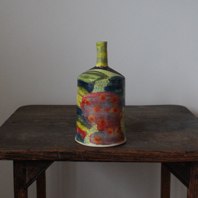 a brightly coloured ceramic bottle by UK potter John Pollex.