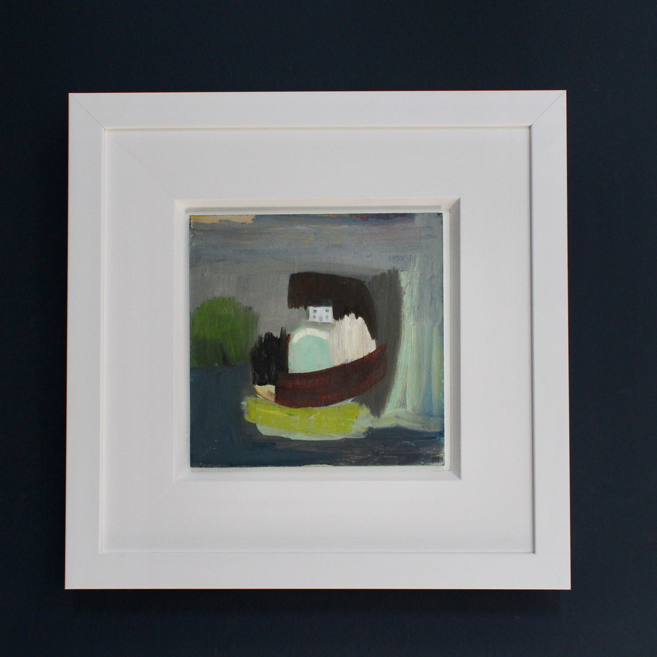 Framed abstract landscape painting by Cornish artist with white house, green tree and blue 