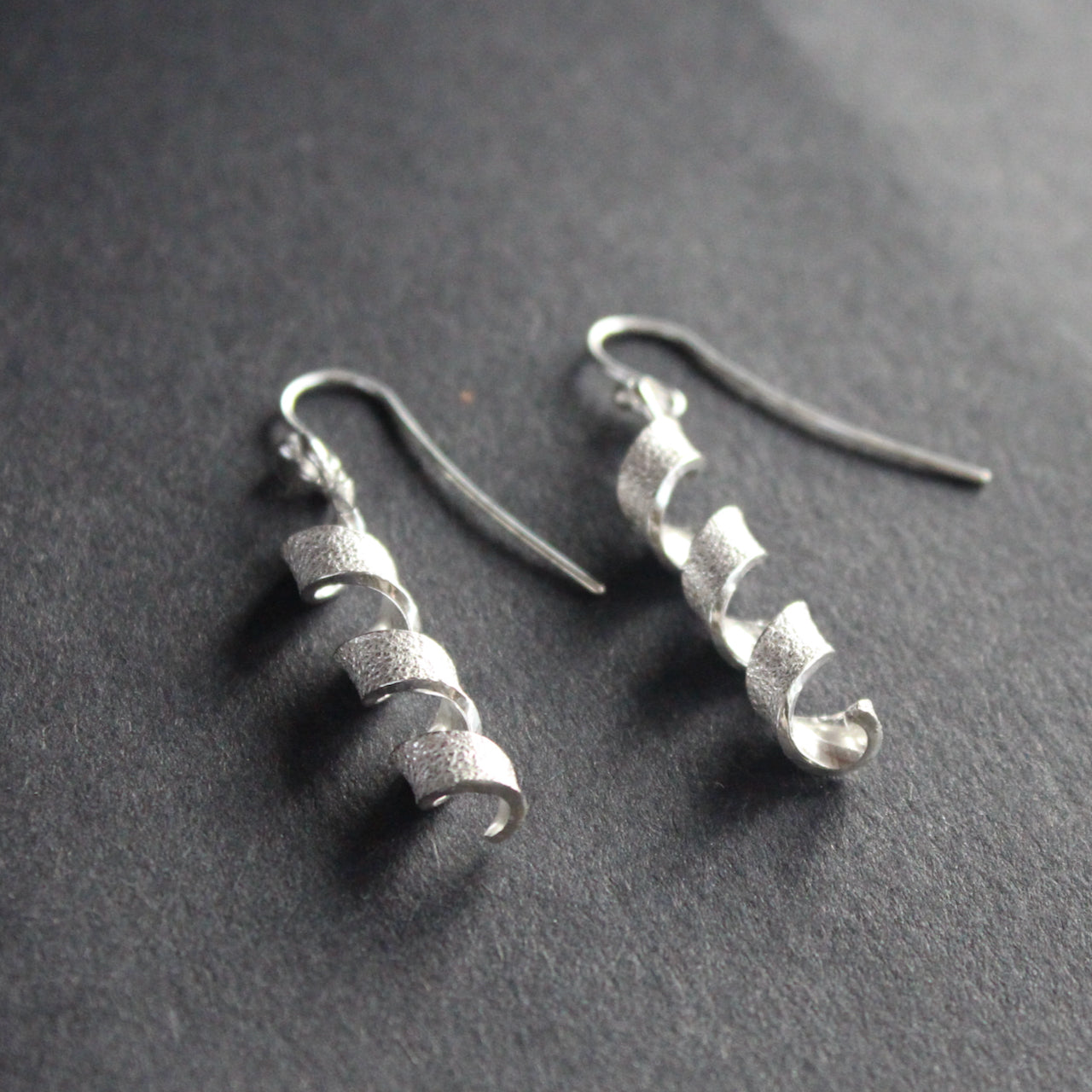 pair of silver helix twisted earrings by Beverly Bartlett by Uk jewellery designer