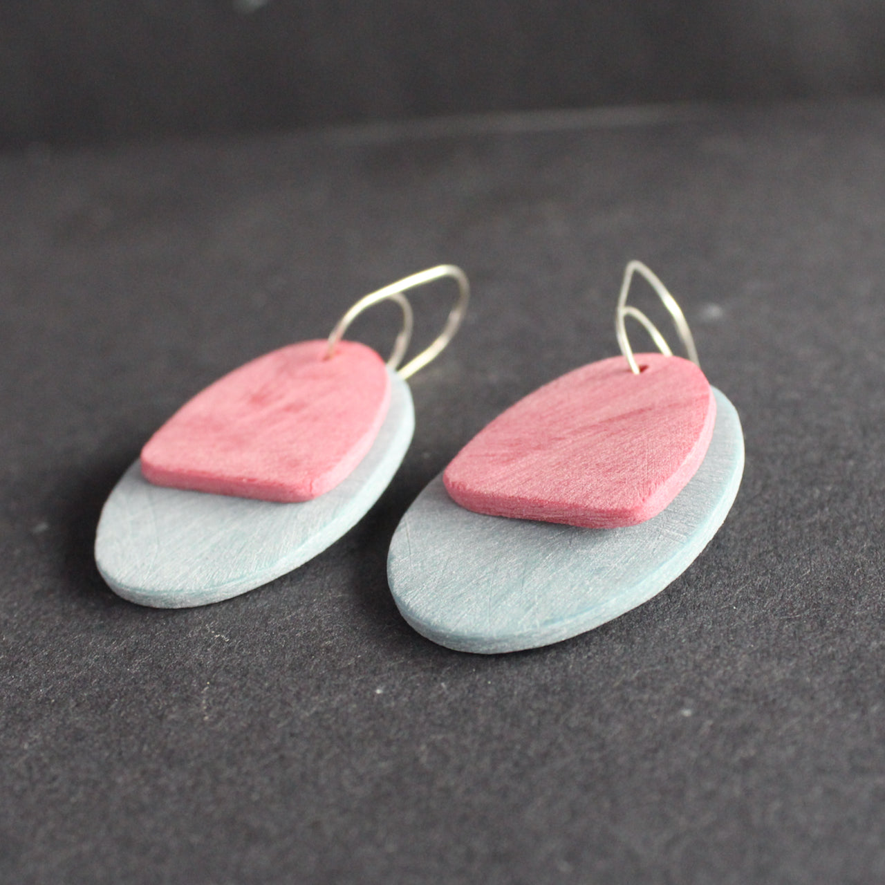 oval shaped earrings in pale blue and pink by UK jewellery designer Clare Lloyd.
