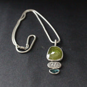 Sphene and blue tourmaline textured silver duo pendants by Carin Lindberg