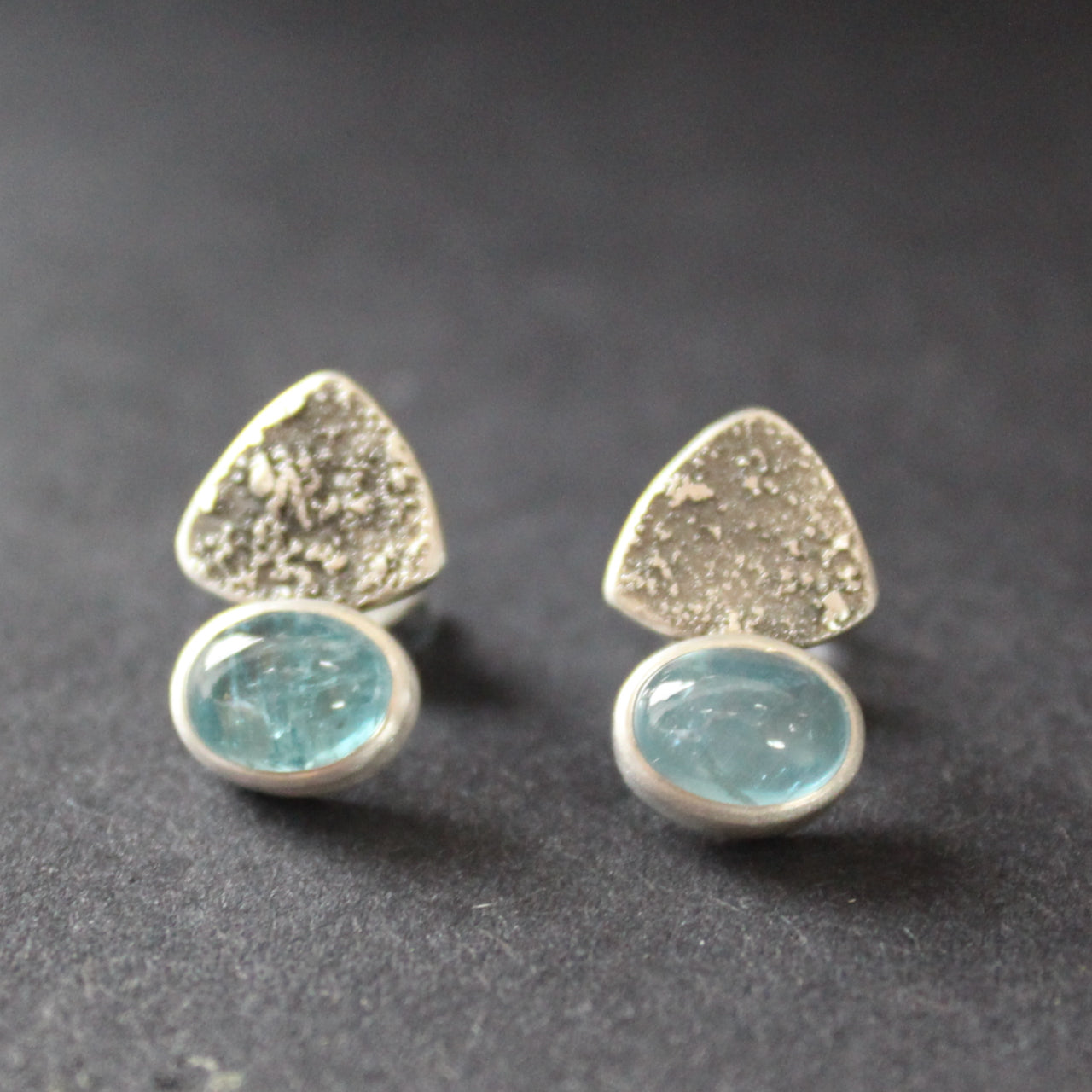 textured silver earrings with blue stone by jeweller Carin Lindberg
